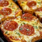 Air fryer pizza toast topped with cheese and pepperoni