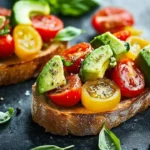 Delicious avocado, tomato, and basil bruschetta served on toasted bread