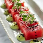 Avocado-Wasabi Cream served with Watermelon 'Tuna' on a decorative plate.