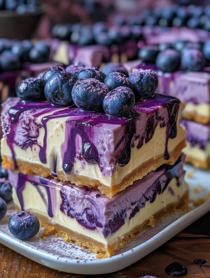 Blueberry cheesecake bars with a delicious blueberry drip on top