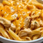 Creamy Honey BBQ Chicken & Cheddar Pasta dish topped with fresh herbs