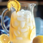Refreshing creamy lemonade served in a glass with lemon slices