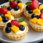Delicious creamy mini fruit tarts topped with fresh fruits and creamy filling