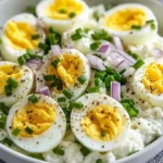 Egg salad with cottage cheese and fresh herbs served in a bowl