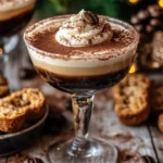 Espresso Tiramisu Mocktini garnished with cocoa and coffee beans.