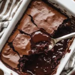 Gooey sourdough chocolate cobbler topped with melted chocolate and served warm