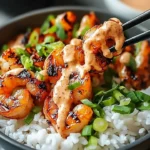 Hawaiian shrimp poke bowl topped with sriracha mayo and fresh ingredients