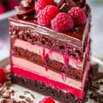 Heavenly Raspberry Chocolate Mousse Cake with fresh raspberries and chocolate topping