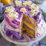 Lavender Lemon Cream Cake with White Chocolate Frosting garnished with lavender flowers