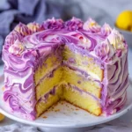 Lavender Lemon Cream Cake with White Chocolate Frosting on a decorative plate