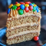 M&M's Peanut Butter Cake with creamy peanut butter frosting on top