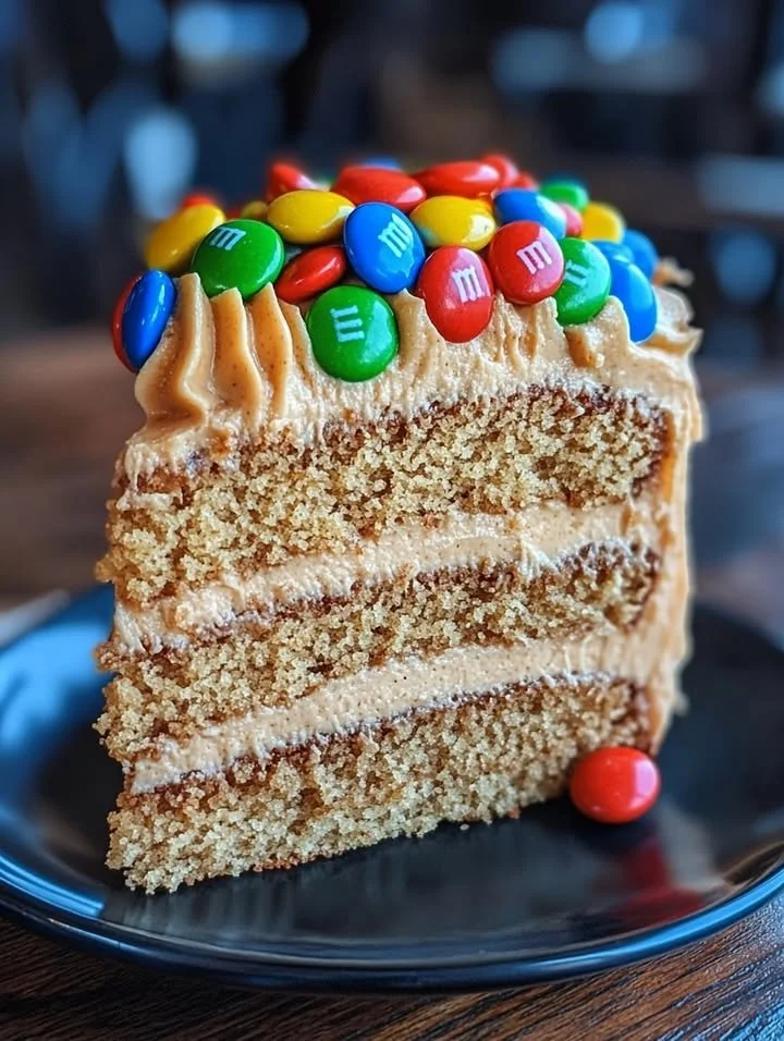 M&M's Peanut Butter Cake with creamy peanut butter frosting on top