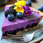 No-bake vegan blueberry chia seed pie topped with fresh blueberries