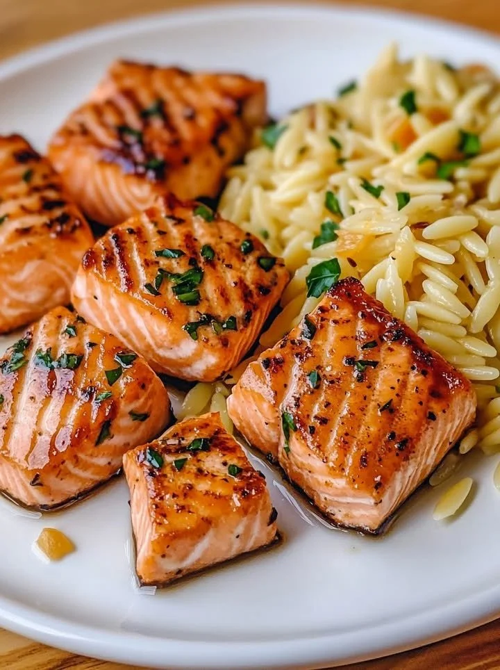 Delicious salmon bites served with lemon butter orzo dish