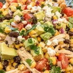 Colorful Southwest Chicken Salad with grilled chicken, lettuce, and fresh toppings.