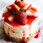 Strawberry Shortcake Cheesecake topped with fresh strawberries