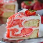 Delicious Velvet Lemon Cream Cake with a colorful strawberry swirl topping.