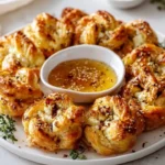 Whipped feta puff pastry flower with hot honey center on a serving platter