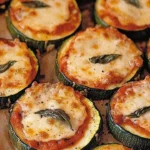 Delicious zucchini pizza bites topped with cheese and herbs